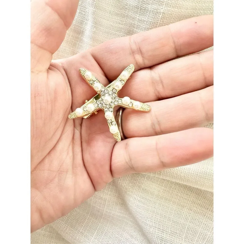 Faux pearl and rhinestone gold starfish hair clip